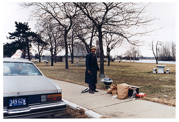 Man With Child and Small Barbecue